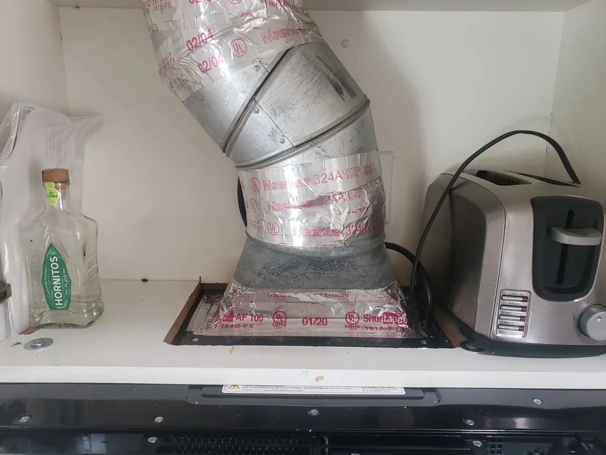 Over-the-range microwave installation with upper cabinet vent connection